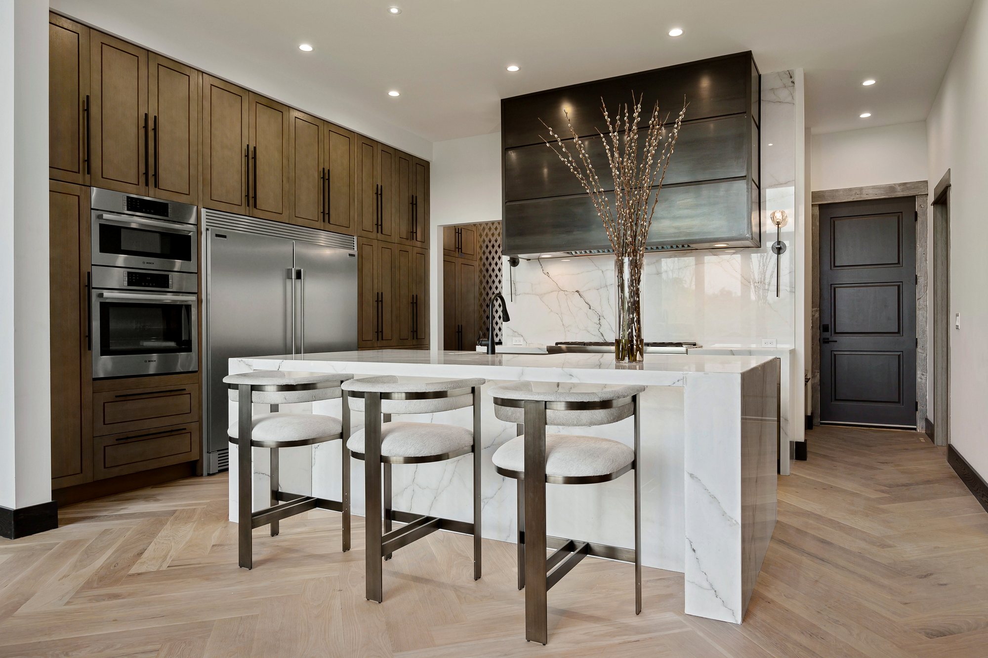 Custom residence — waterfall quartz island with seating