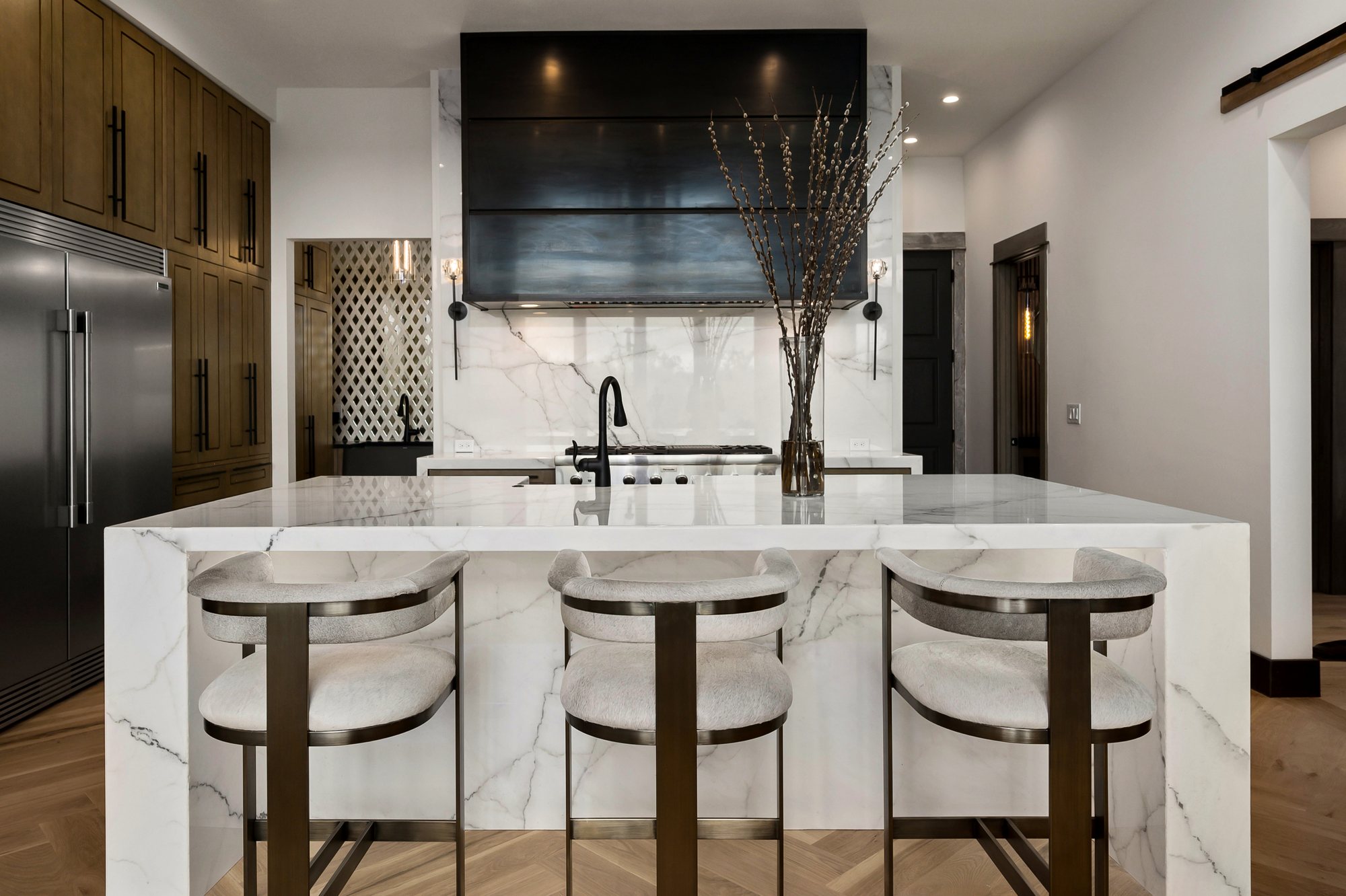 Custom residence — stained kitchen with stone backsplash
