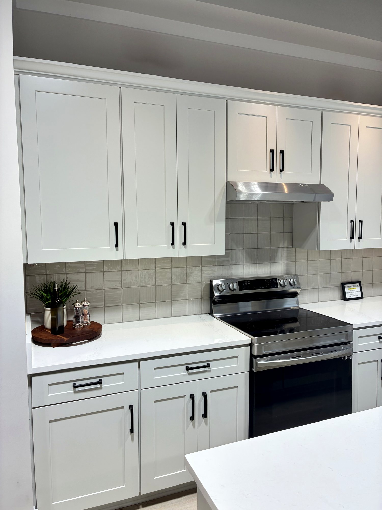 White shaker kitchen with tile backsplash