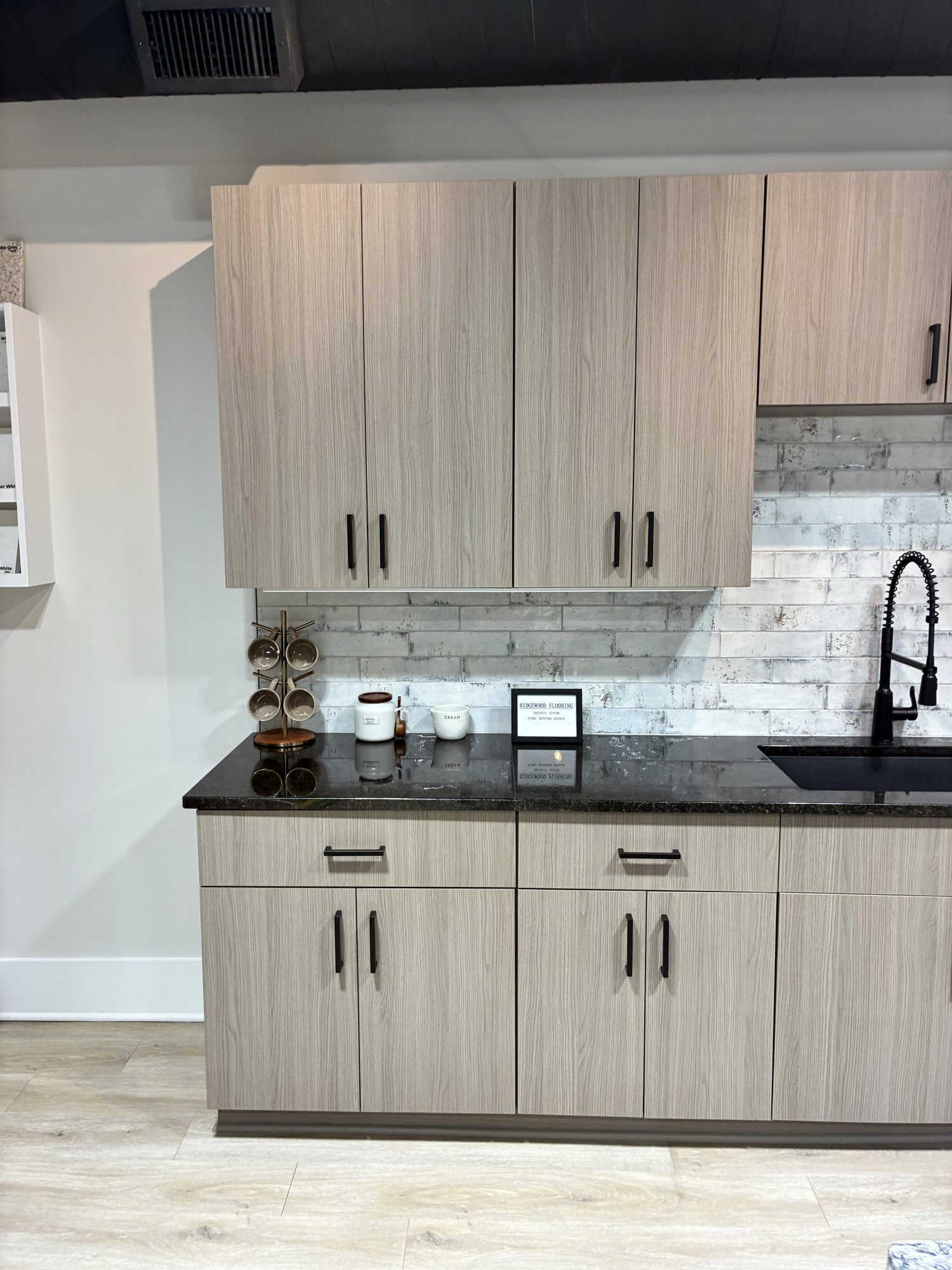Woodgrain cabinet run with dark countertop